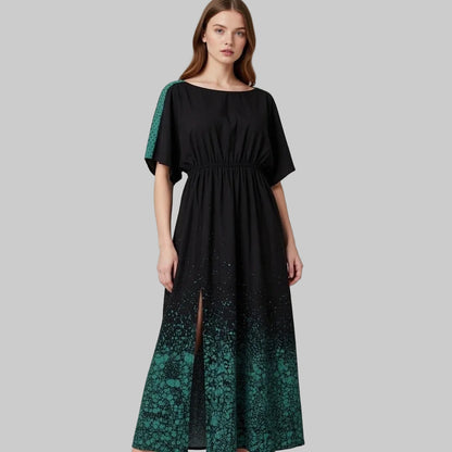 Black dress with green lace sleeves and hem on green design a grey background