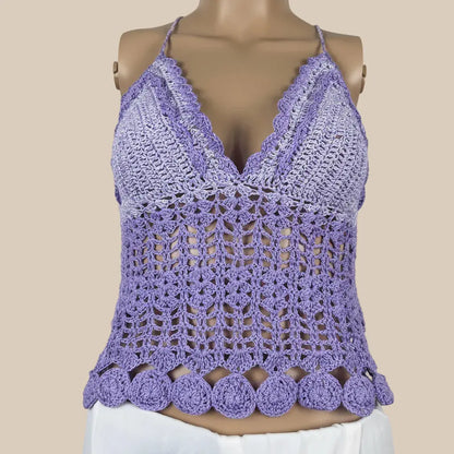 A lavender purple crochet halter top displayed on a mannequin torso against a solid beige background.
