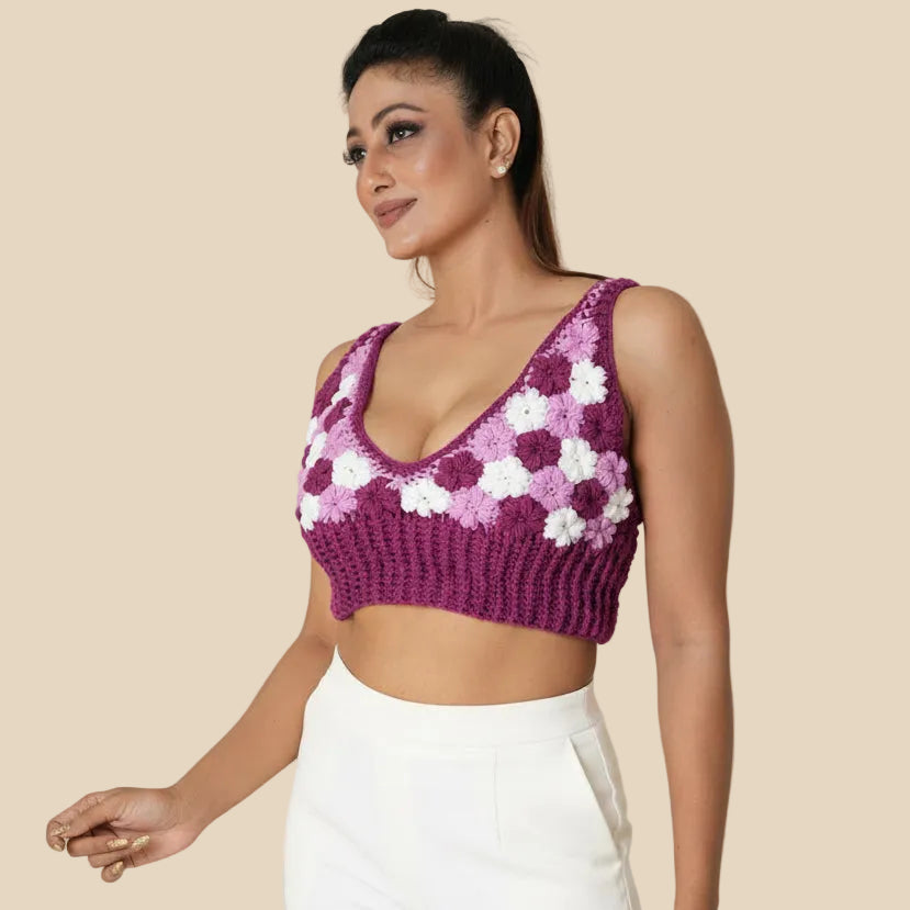 Woman wearing a white and purple floral top on a white background