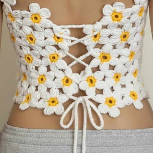 Back view: Open back crochet daisy top with adjustable lace-up tie detail and floral straps.

