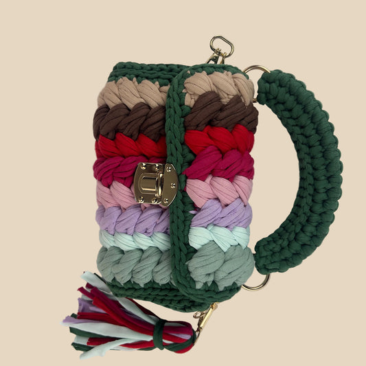 Colorful braided keychain with a tassel on a white background